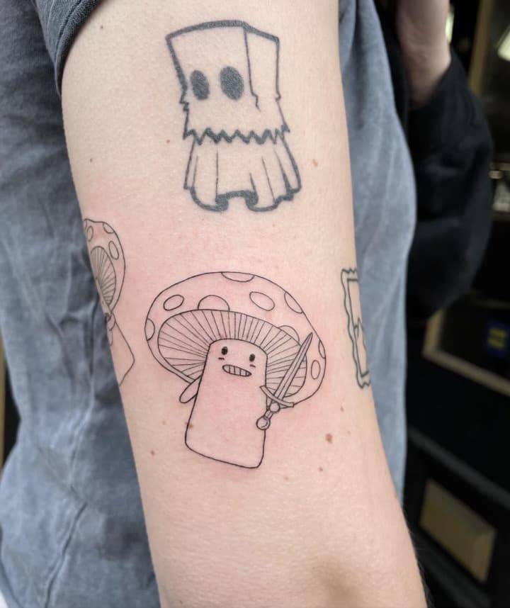 fine line ghost and mushroom warrior arm tattoo by Ale Muñoz, Philadelphia PA