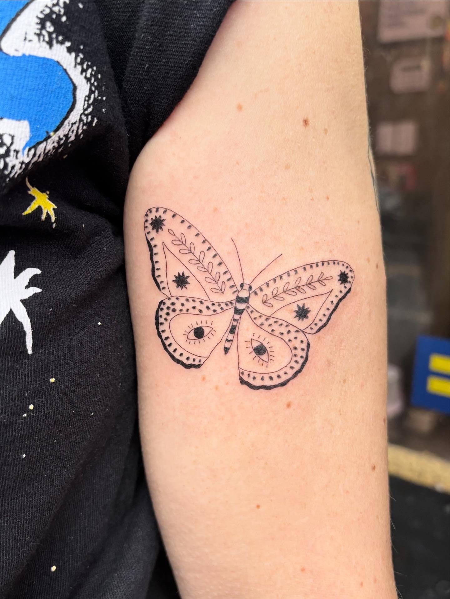 fine line ornamental butterfly arm tattoo by Ale Muñoz, Philadelphia PA