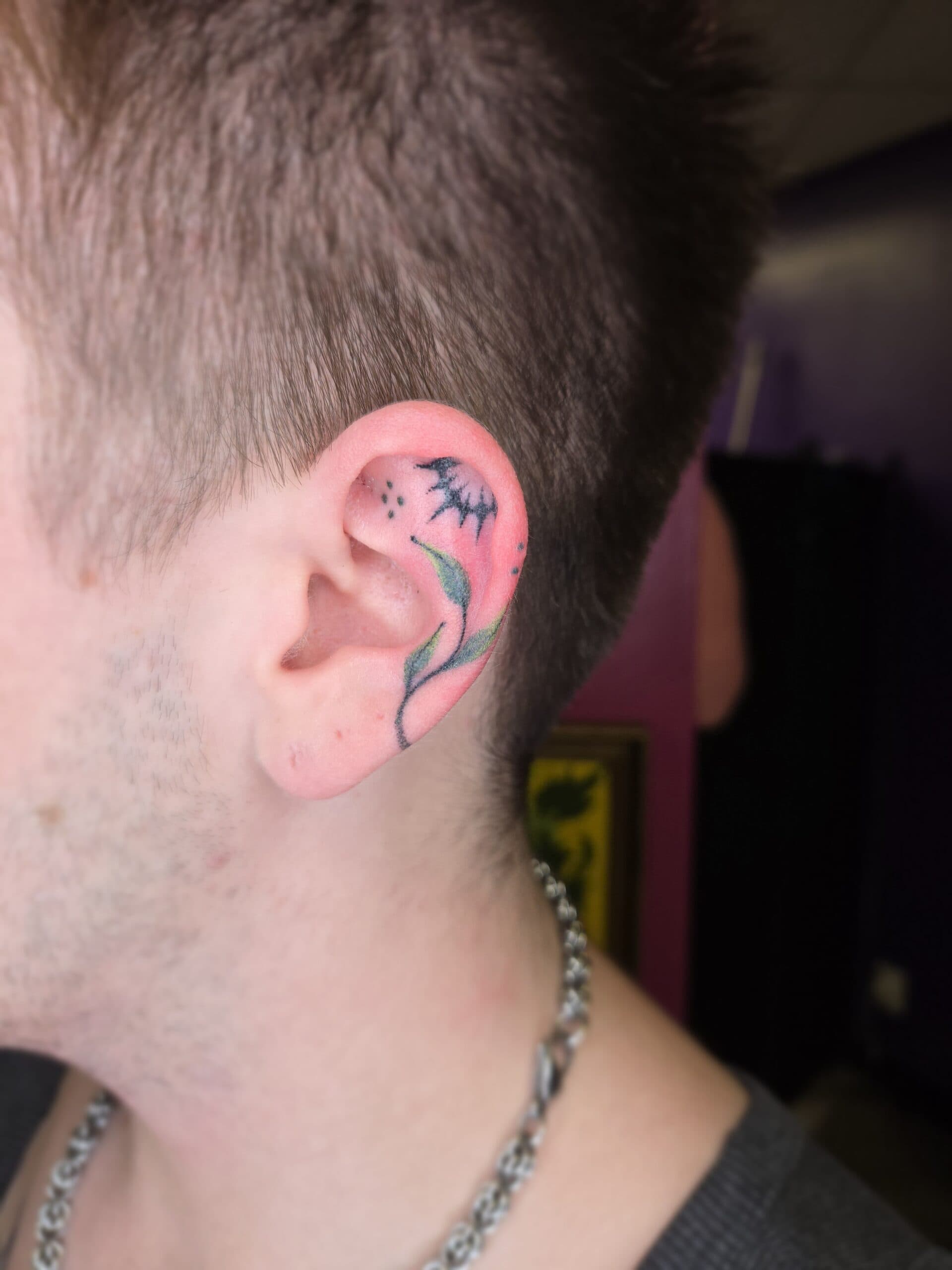 bat flower ear tattoo by Bird, Philadelphia PA
