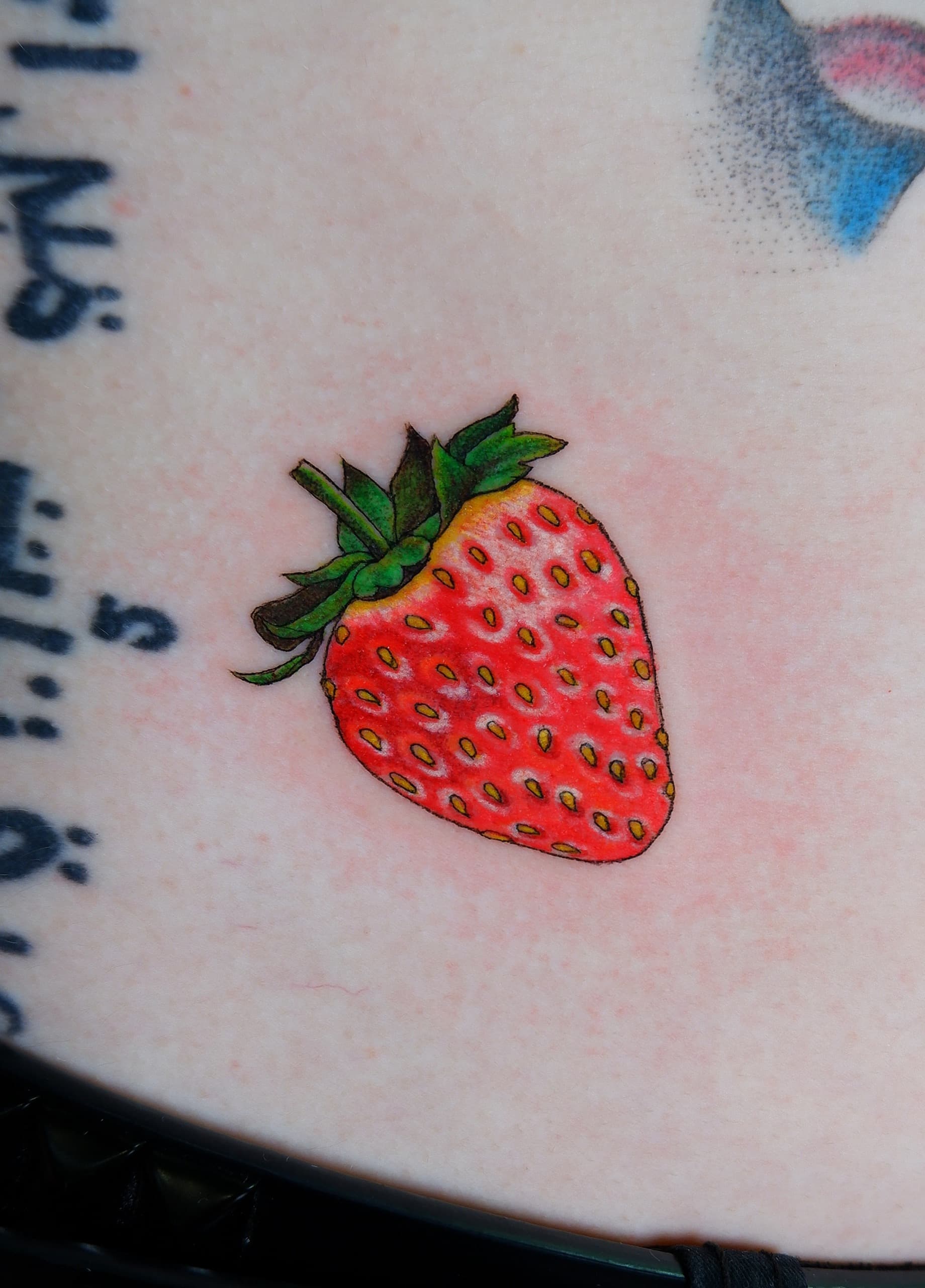 color strawberry hip tattoo by Bird, Philadelphia PA