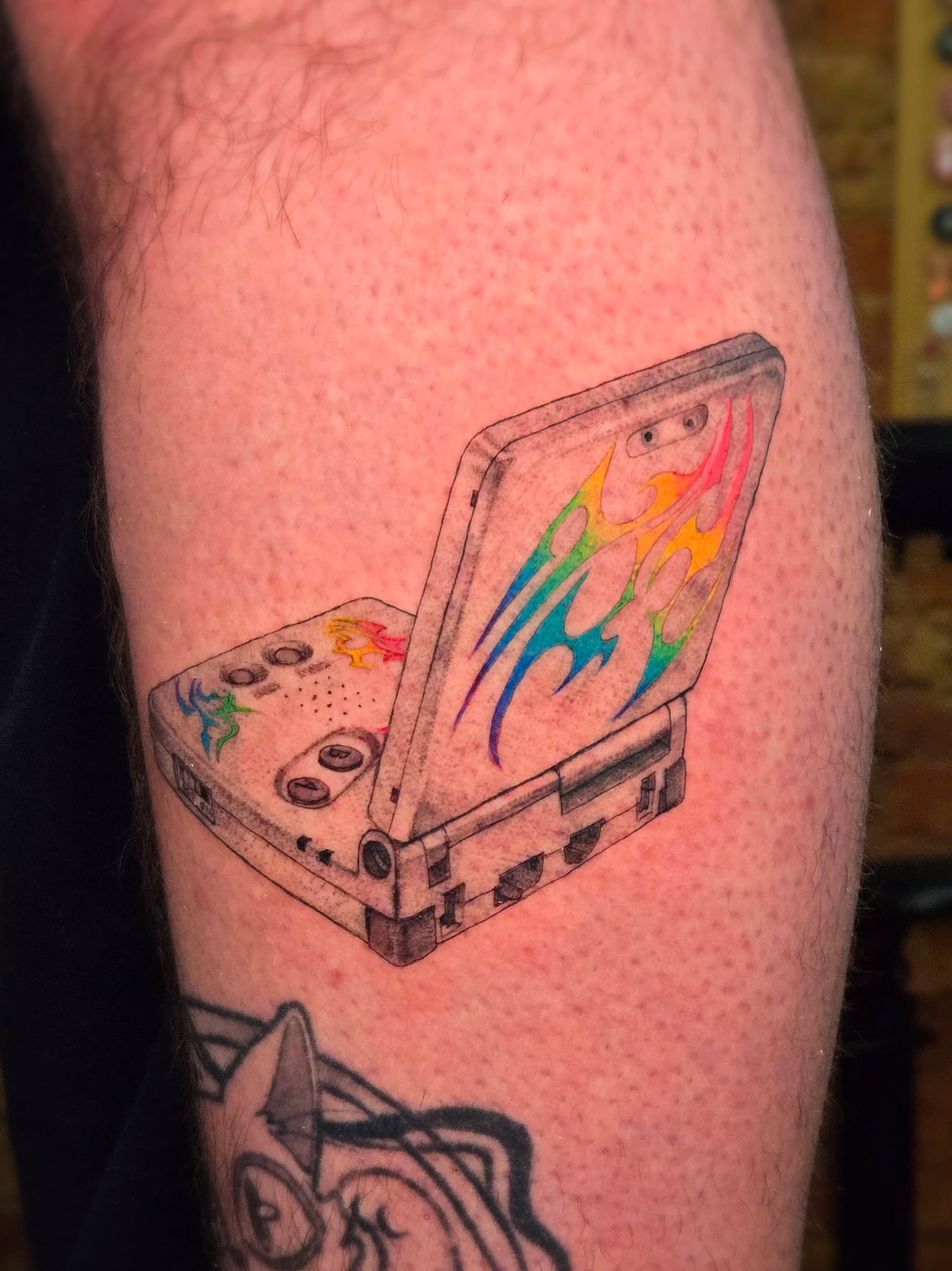 game boy advance sp rainbow flames leg tattoo by Bird, Philadelphia PA