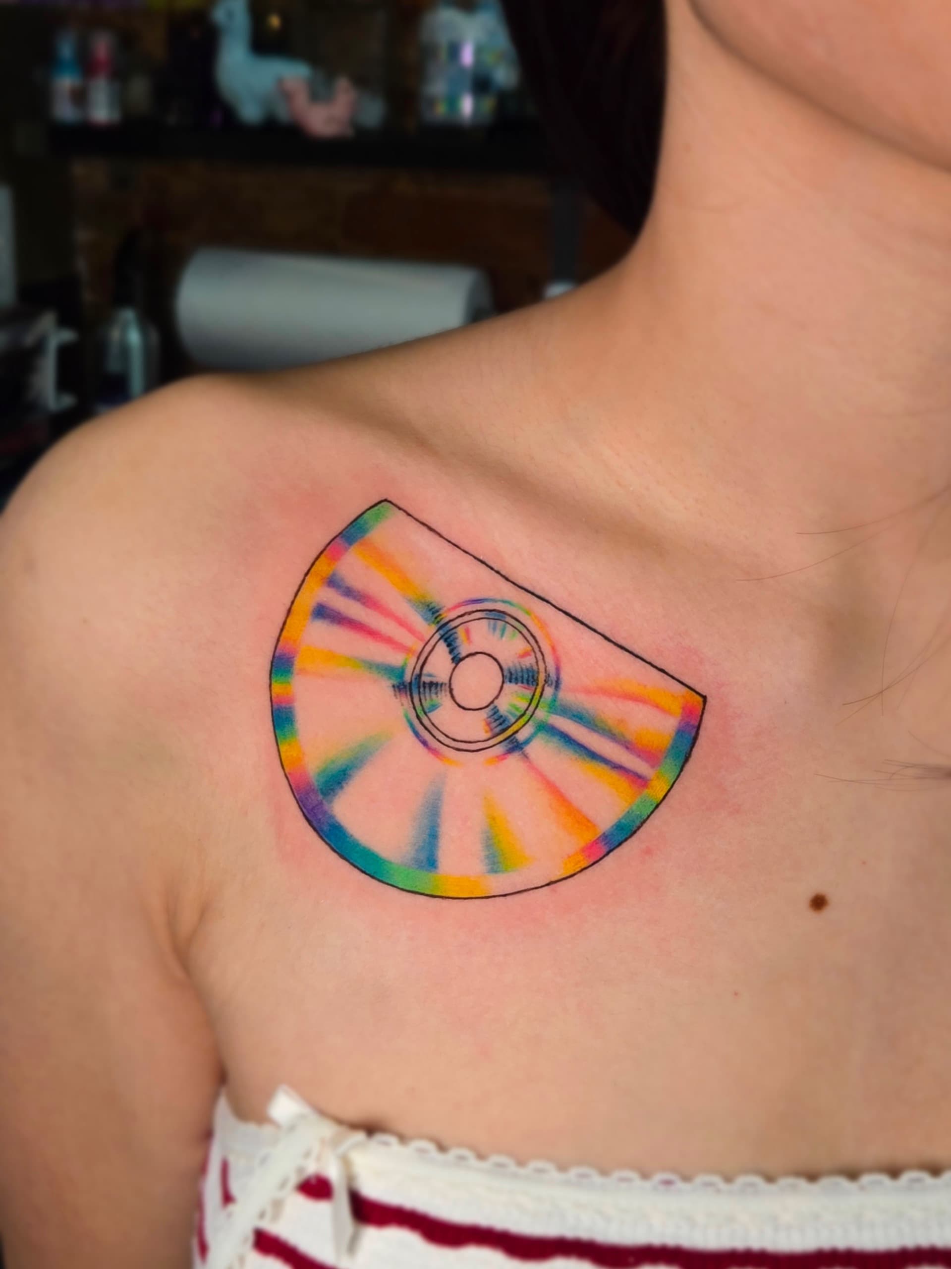holographic half cd collarbone tattoo by Bird, Philadelphia PA