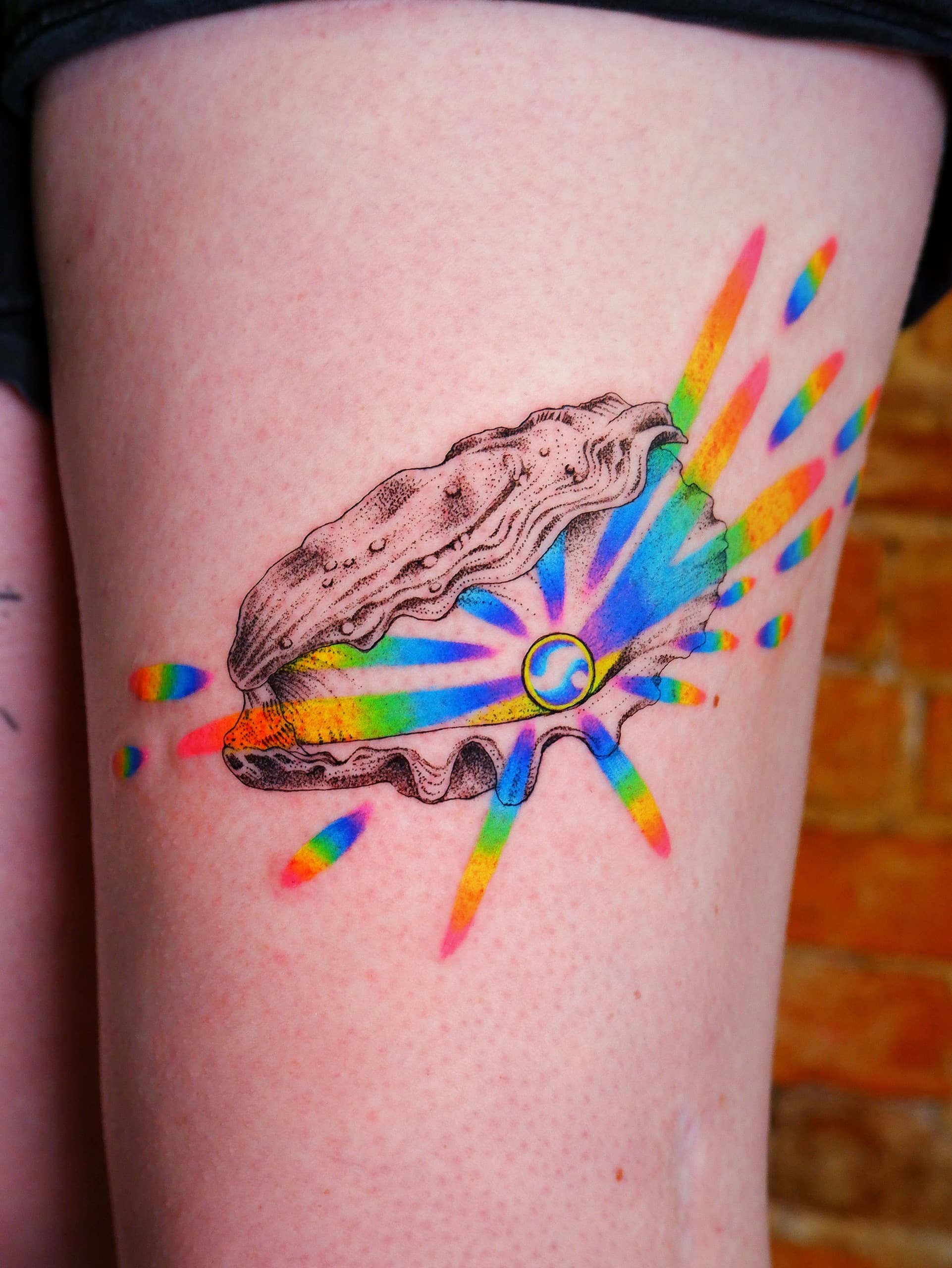 holographic oyster pearl thigh tattoo by Bird, Philadelphia PA