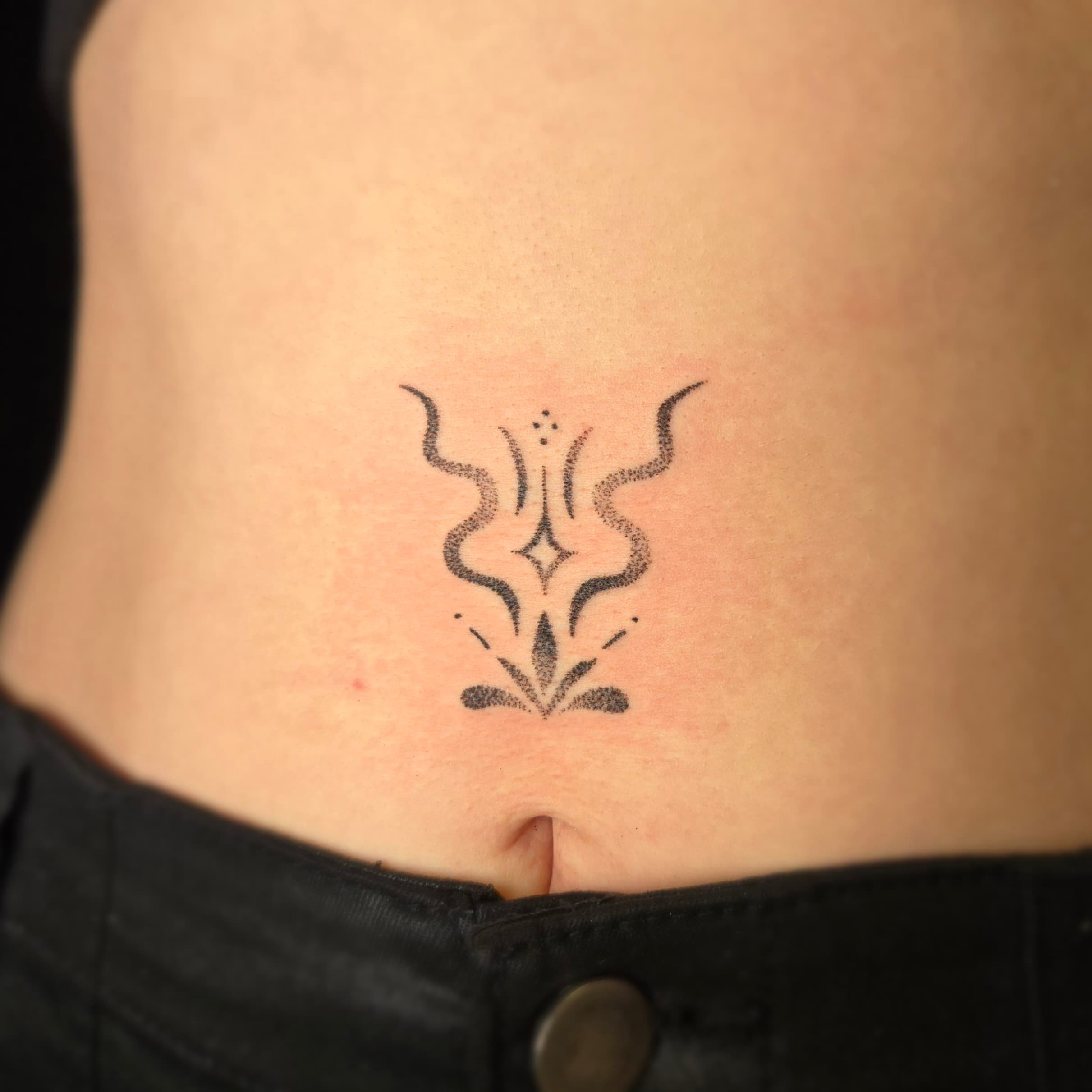 ornamental dotwork stomach tattoo by Bird, Philadelphia PA