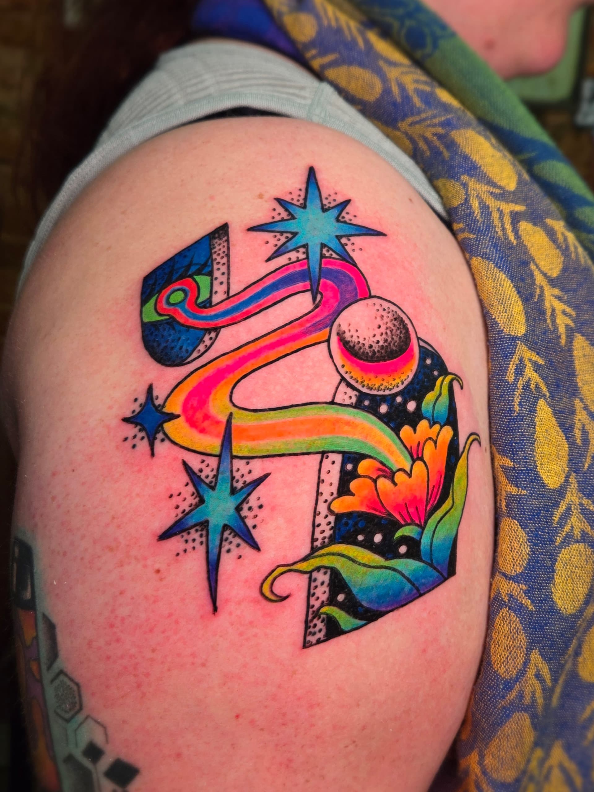 psychedelic rainbow planet flower shoulder tattoo by Bird, Philadelphia PA