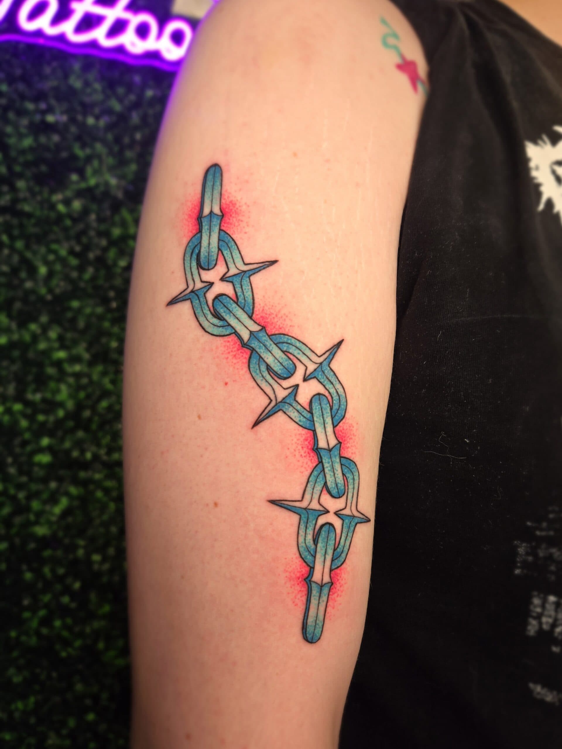 traditional barbed wire chain arm tattoo by Bird, Philadelphia PA