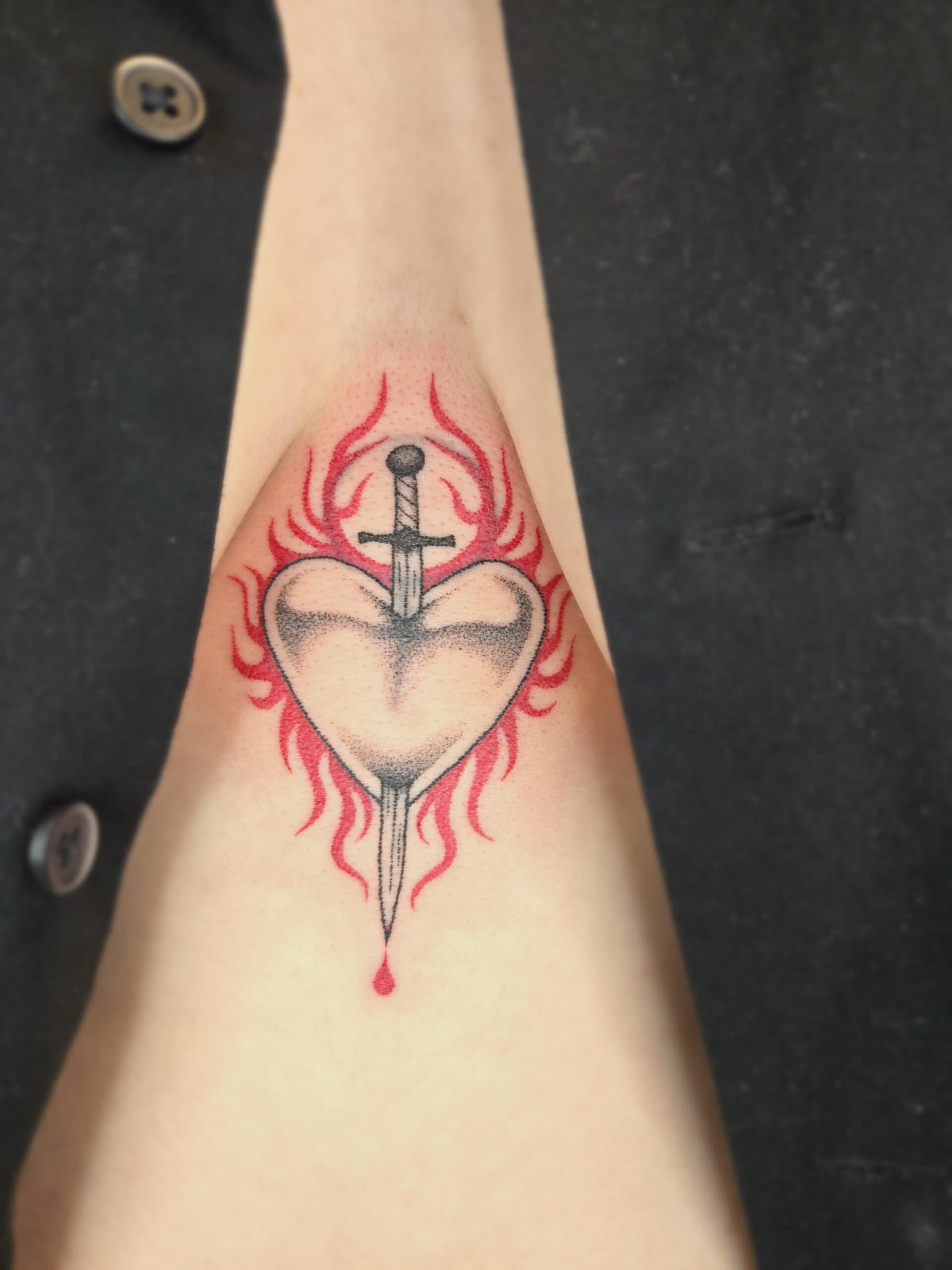 traditional flaming heart dagger arm tattoo by Bird, Philadelphia PA