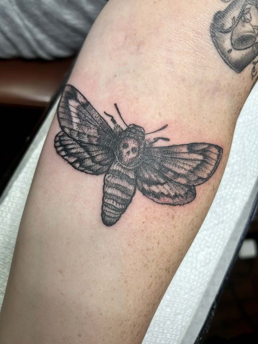 deaths head moth arm tattoo by John Howie, Philadelphia PA