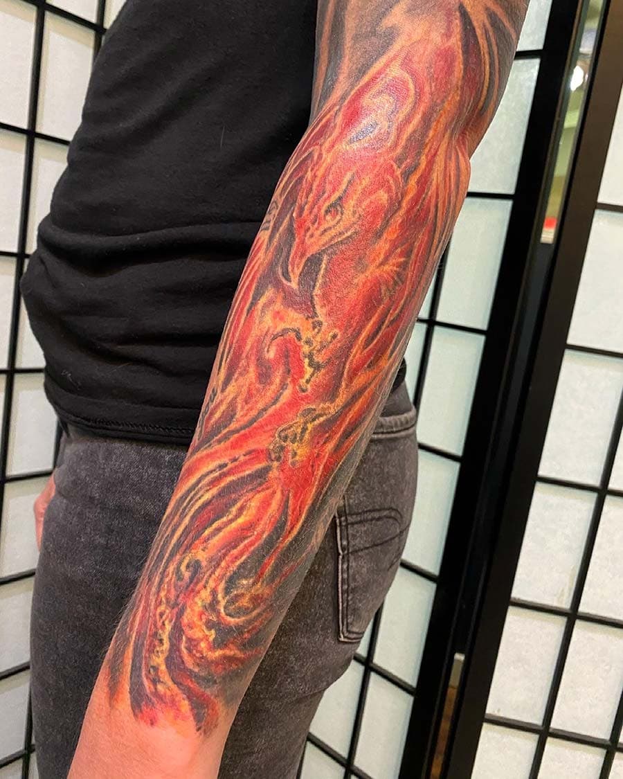 red phoenix flame sleeve tattoo by John Howie, Philadelphia PA